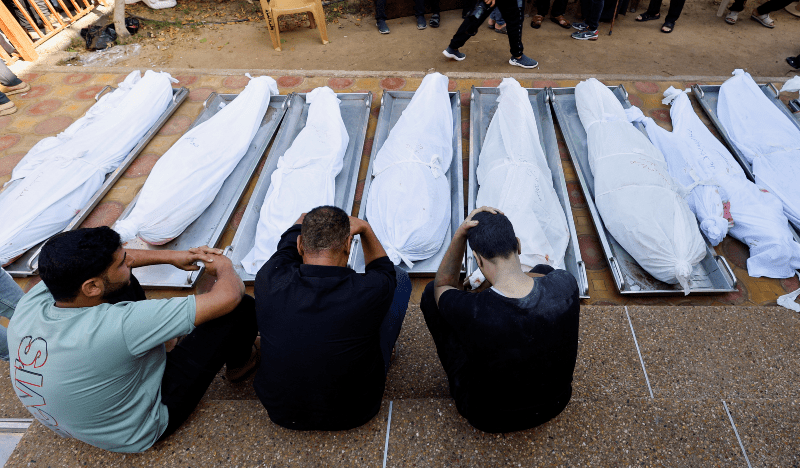  People react next to bodies of Palestinians who were killed in an Israeli strike, at the morgue of Nasser hospital, in Khan Younis in the southern Gaza Strip on Nov 7, 2023. &mdash; Reuters 