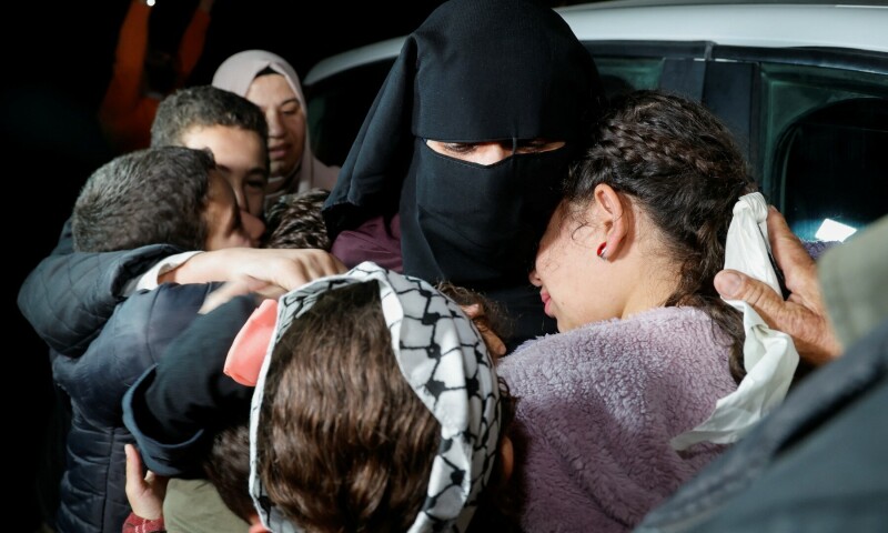 In pictures: Tears and joy as Israeli hostages, Palestinian prisoners reunite with loved ones