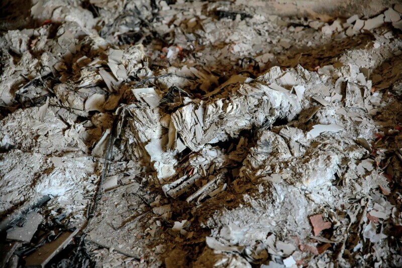 Documents reduced to ashes are scattered inside the archives department of the Gaza municipality building in Gaza City on November 30. &mdash; AFP