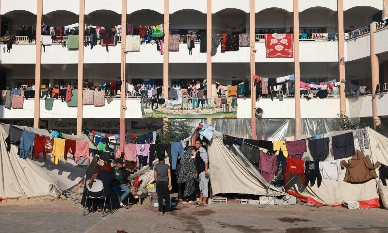 Displaced Palestinians set up shelters in the courtyard of a government-run school in Rafah in the southern Gaza Strip. &mdash; AFP