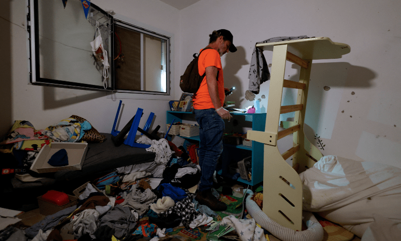  Jimmy Miller, a cousin of Shiri Bibas, who was taken hostage, along with her children Kfir, Ariel, and her husband Yarden by Hamas during the deadly Oct 7 attack, visits the family house of Shiri Bibas, in kibbutz Nir Oz, Israel on Dec 5, 2023. &mdash; Reuters 