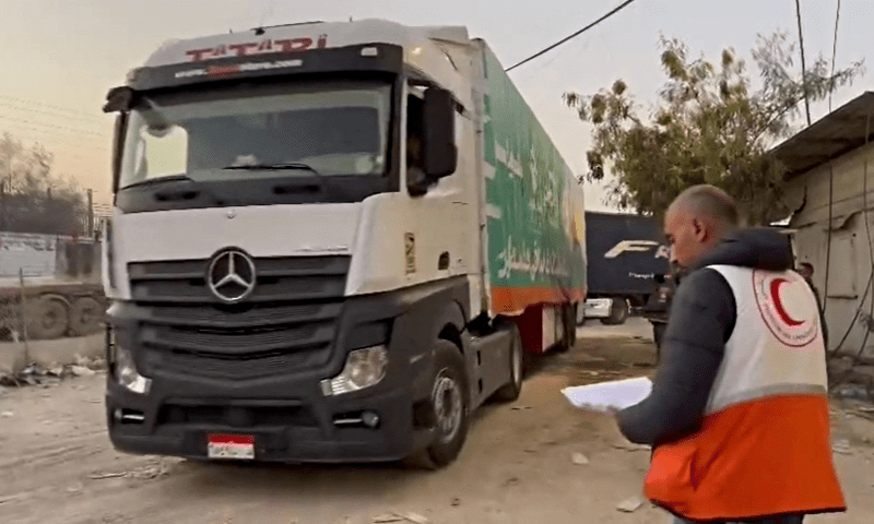  Aid and relief assistance materials are transported in trucks at a location given as Rafah border crossing, in this screen grab obtained from video released on Dec 7, 2023. &mdash; PRCS via Reuters 