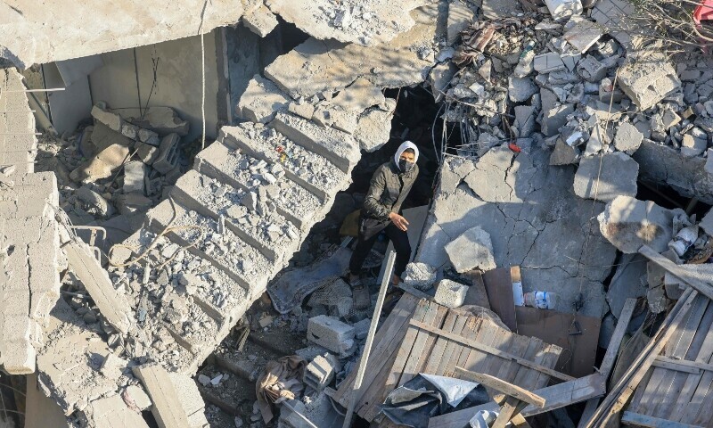 A man walks among the rubble of a building destroyed destroyed Israeli bombardment overnight in Rafah on the southern Gaza Strip on December 7, 2023. &mdash; AFP