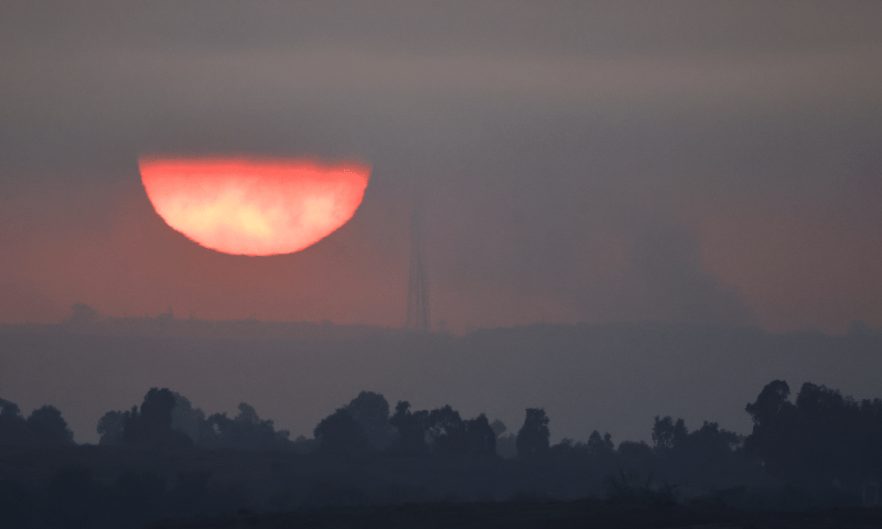  Smoke rises from the Khan Yunis direction in Gaza during sunset, as seen from Southern Israel on Dec 15, 2023. &mdash; Reuters 