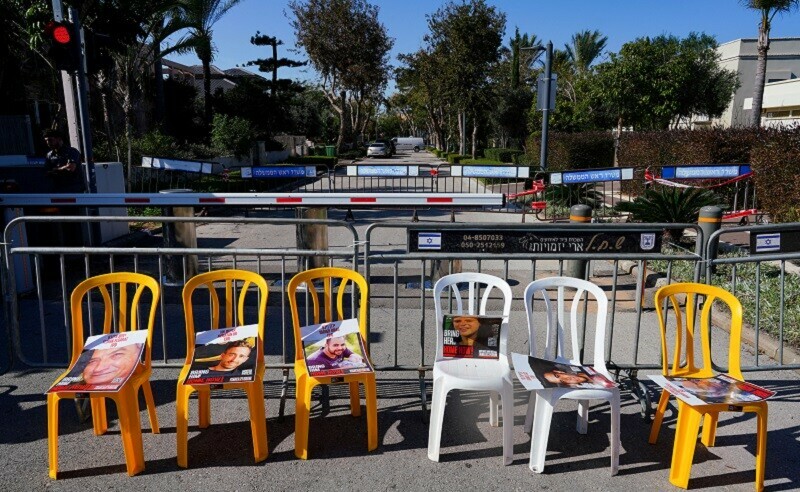  Posters are placed on chairs as supporters and family members of hostages camp outside the residence of Israeli Prime Minister Benjamin Netanyahu. &mdash; Reuters