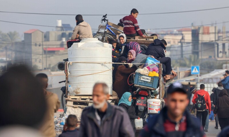 Displaced Palestinians leave a makeshift tent camp in Rafah near the border with Egypt in the southern Gaza Strip, in a truck loaded with their belongings heading to central areas of the Palestinian territory, on January 21, 2024. &mdash; AFP