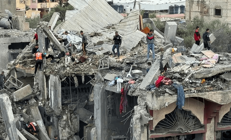 Palestinians search for casualties at the site of Israeli strikes on a house in Rafah in the southern Gaza Strip. &mdash; Reuters