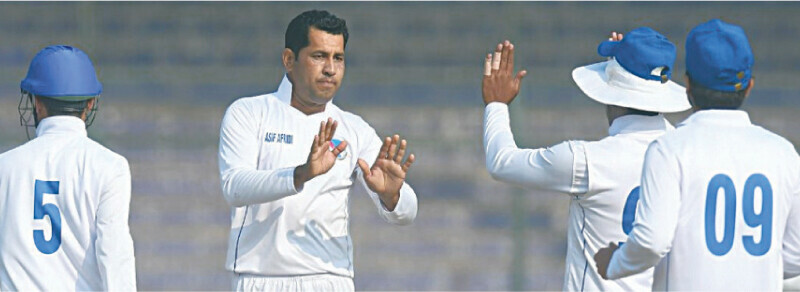  WAPDA spinner Asif Afridi (second L) celebrates with team-mates during the President&rsquo;s Trophy match against PTV at the National Bank Stadium on Monday.&mdash;courtesy PCB 