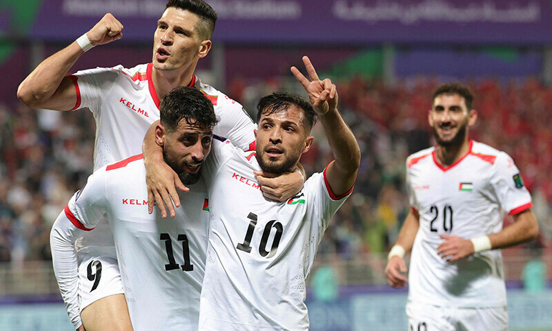 Palestine’s forward #11 Oday Dabbagh celebrates with teammates after scoring their third goal during the Qatar 2023 AFC Asian Cup Group C football match between Hong Kong and Palestine at the Abdullah bin Khalifa Stadium in Doha on January 23. — AFP