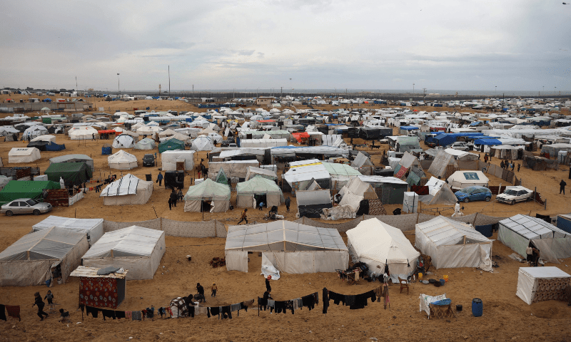 A picture shows a makeshift tent camp for displaced Palestinians in rainy weather in Rafah in the southern Gaza Strip on Feb 2, 2024. &mdash; AFP