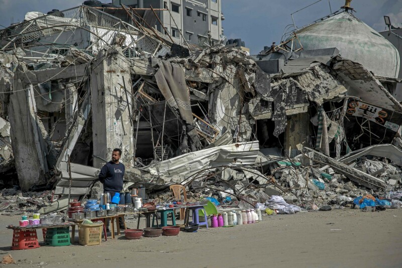 A vendor waits for customers along a street in Gaza City on February 24. &mdash; AFP