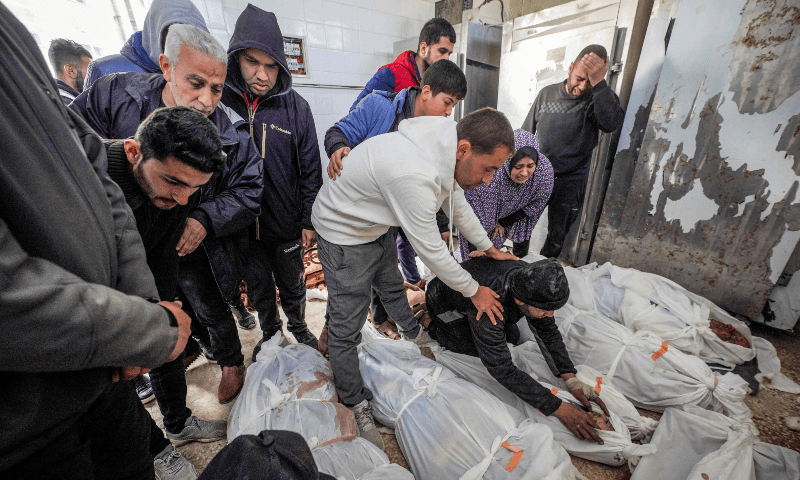  Palestinians react at al-Aqsa hospital in Deir el-Balah as they mourn over the bodies of loved ones killed during Israeli bombardment, in the central Gaza Strip, on March 6, 2024. &mdash; AFP 