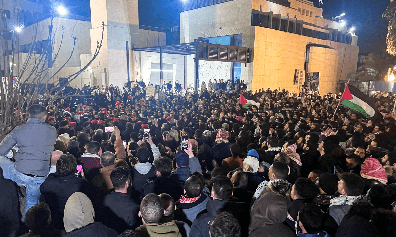  Demonstrators carry flags and banners during a protest in support of Palestinians in Gaza outside Al Kalouti mosque near the Israeli embassy in Amman, Jordan on March 24, 2024. &mdash; Reuters 