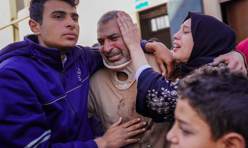  A Palestinian family mourns the death of a relative, killed in overnight Israeli bombardment, at Al-Aqsa Martyrs Hospital in Deir al-Balah on March 25. &mdash; AFP 