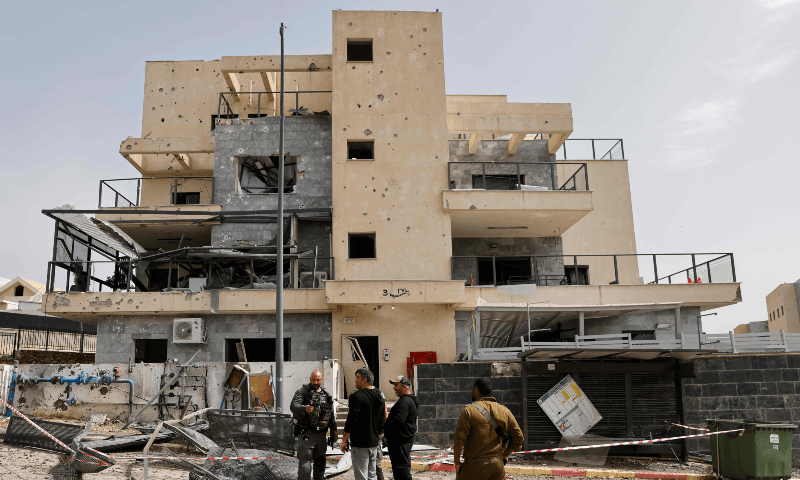  Israeli forces check the area of building that hit was by Hezbollah in Kiryat Shmona in northern Israel near the Lebanon border on March 27. &mdash; AFP 