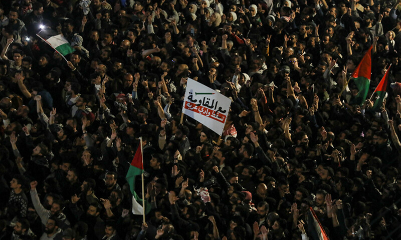 People protest in support of Palestinians in Gaza near the Israeli embassy in Amman, Jordan, March 28, 2024. &mdash; Reuters
