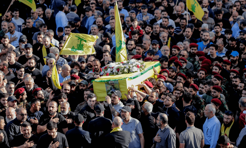  Hezbollah fighters carry the coffin of commander Ahmed Shehimi, who was killed in an Israeli raid in Syria early on March 29, during his funeral procession in southern Beirut on April 1. &mdash; AFP 