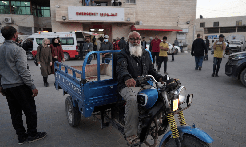  An elderly man drives a vehicle in front of the Shuhada al-Aqsa Hospital in Deir el-Balah in the central Gaza Strip on April 3. &mdash; AFP 