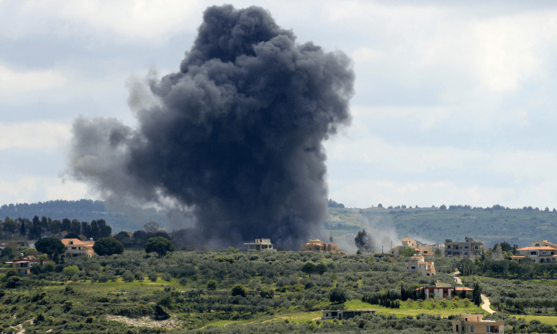  Smoke billows after an Israeli strike on the southern Lebanese border village of Tayr Harfa on April 6. &mdash; AFP 