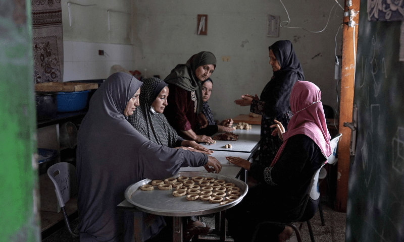  Palestinian women prepare traditional cookies ahead of Eid al-Fitr, in Deir el-Balah in the central Gaza Strip on April 8. &mdash; AFP 