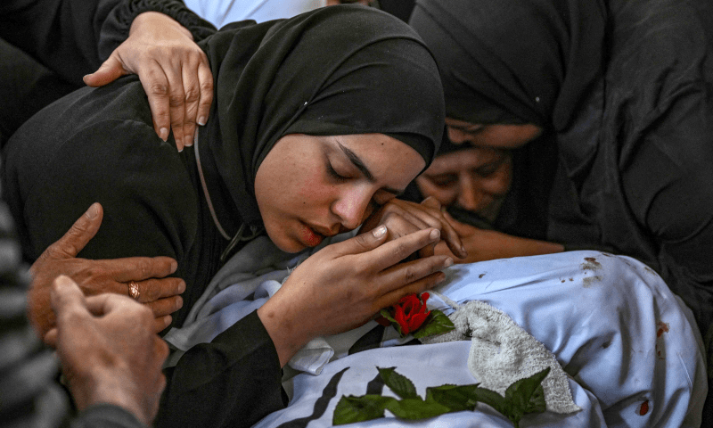  A woman mourns over the body of a man killed in an Israeli raid in the Nur Shams camp for Palestinian refugees in the occupied West Bank, during his funeral on April 21, 2024.&mdash; AFP 