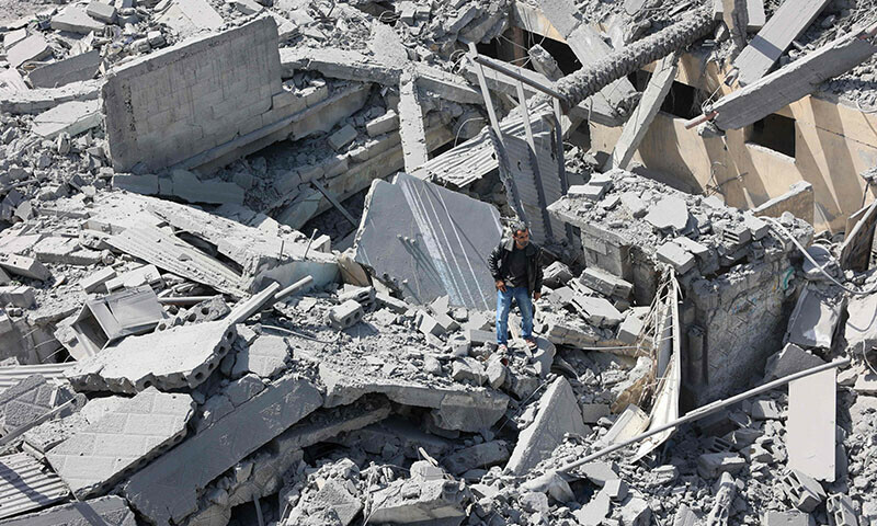 A Palestinian inspects the debris after the Israeli bombardment of the Al-Daraj neighbourhood in Gaza City on April 22. &mdash; AFP