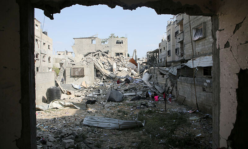 Palestinians inspect the site of an Israeli strike on a house in Rafah, in the southern Gaza Strip on April 29. &mdash; Reuters