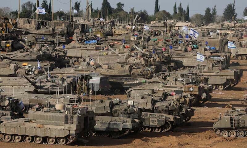 Israeli military vehicles are seen near the Israel-Gaza Border on May 9. &mdash; Reuters