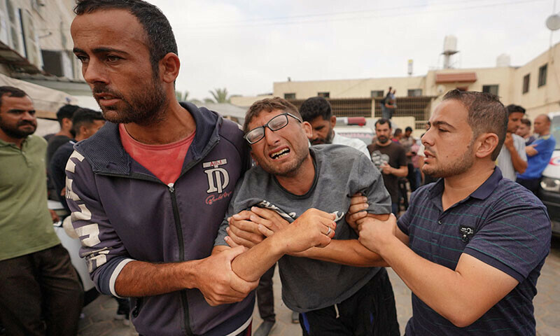 A Palestinian man mourns his relative killed in an Israeli strike during a funeral at the Al-Aqsa Martyrs Hospital in Deir al-Balah in the central Gaza Strip on June 3. &mdash; AFP