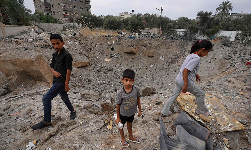 Palestinians inspect the aftermath of an Israeli strike in Nuseirat in the central Gaza Strip on June 3. &mdash; AFP