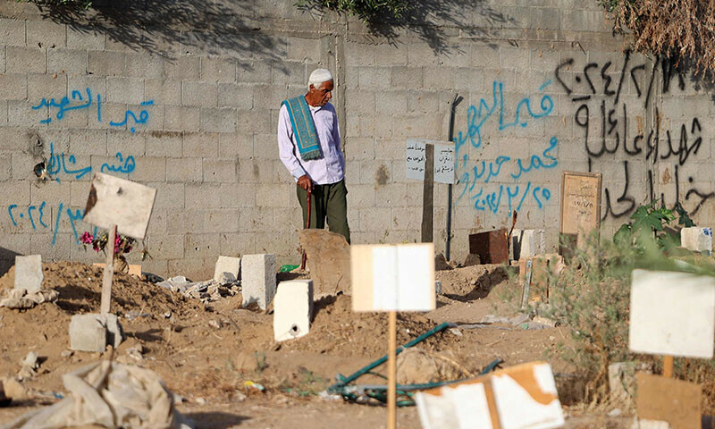 Palestinians hold Eidul Azha prayers by the ruins of Al-Rahma mosque in Khan Younis, in the southern Gaza Strip on June 16. &mdash; Reuters