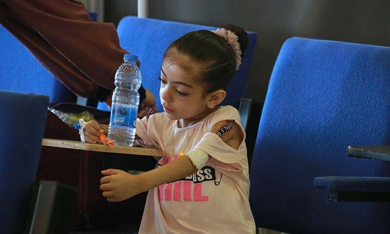 Palestinian children suffering of malnutrition or chronic diseases such as cancer, wait with family members at Nasser hospital in Khan Yunis in the southern Gaza Strip on June 24. &mdash; AFP
