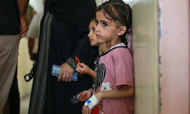 Palestinian children suffering of malnutrition or chronic diseases such as cancer, wait with family members at Nasser hospital in Khan Yunis in the southern Gaza Strip on June 24. &mdash; AFP