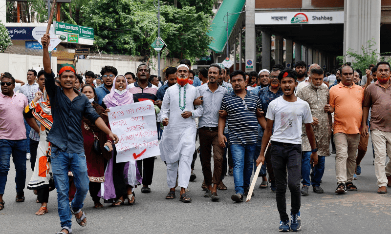  Protesters march on the street demanding the stepping down of Bangladeshi Prime Minister Sheikh Hasina, following quota reform protests by students, in Dhaka, Bangladesh on Aug 4, 2024. — Reuters 