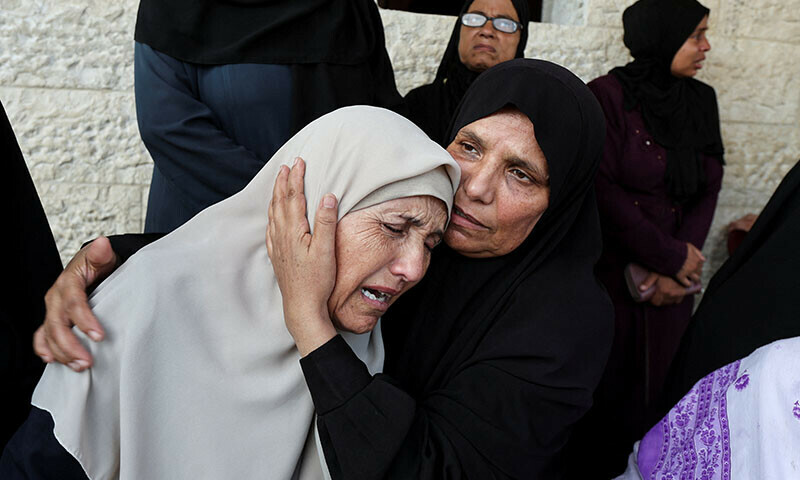 Mourners react during the funeral of Palestinians killed in Israeli strikes, at Al-Aqsa Martyrs hospital in Deir Al-Balah in the central Gaza Strip on August 27. &mdash; Reuters