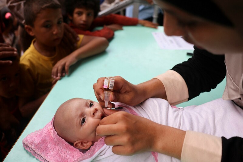  A health worker administers the Polio vaccine to a baby in Zawayda in the central Gaza Strip on September 1. The World Health Organisation said Israel had agreed to at least three days of &ldquo;humanitarian pauses&rdquo; in fighting in parts of Gaza, starting on August 31, to facilitate the vaccination drive. &mdash; AFP  