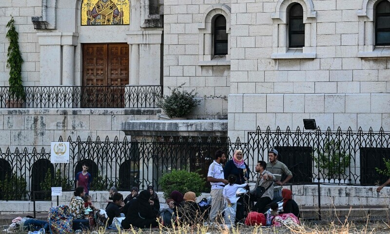 People who fled Israeli bombardment on Beirut&rsquo;s southern suburbs, gather in front of a church the Lebanese capital&rsquo;s downtown district where they spent the night. &mdash; AFP