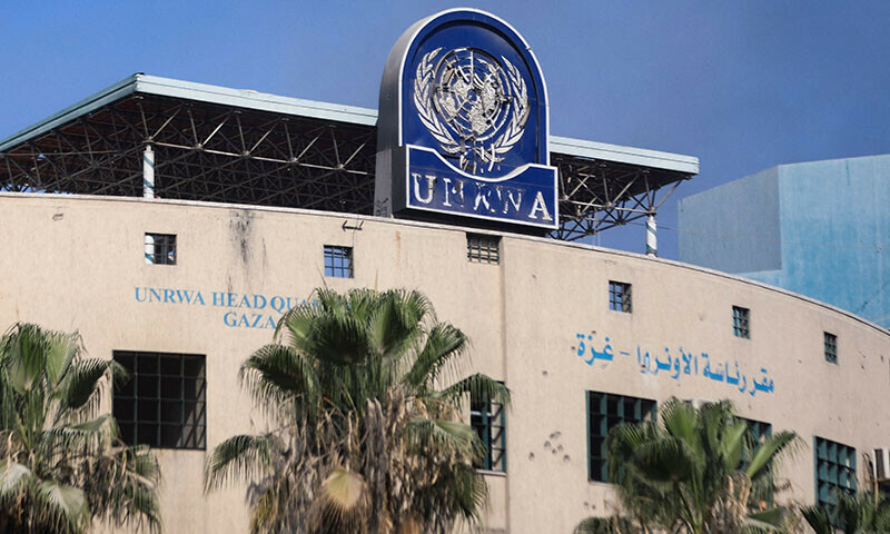 A damaged sign is pictured at the headquarters of UNRWA, following an Israeli raid in Gaza City on July 12. &mdash; Reuters/File