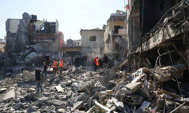 Rescuers search for survivors at the site of an Israeli strike near Rafik Hariri University Hospital in Beirut, Lebanon on October 22. — Reuters