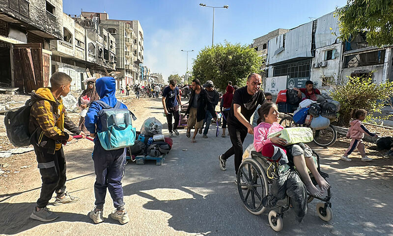 Displaced families fleeing Israeli army operations in Jabalia in northern Gaza take the main Salah al-Din road towards Gaza City on October 23. &mdash; AFP