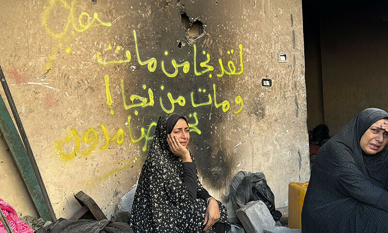 Palestinians mourn relatives killed in an Israeli airstrike in Beit Lahia, in the northern Gaza Strip, on October 29. — AFP