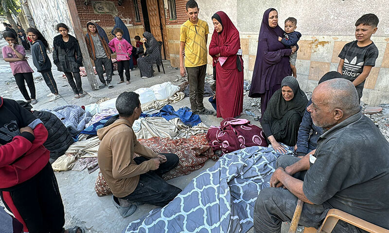 Palestinians mourn relatives killed in an Israeli airstrike in Beit Lahia, in the northern Gaza Strip, on October 29. — AFP