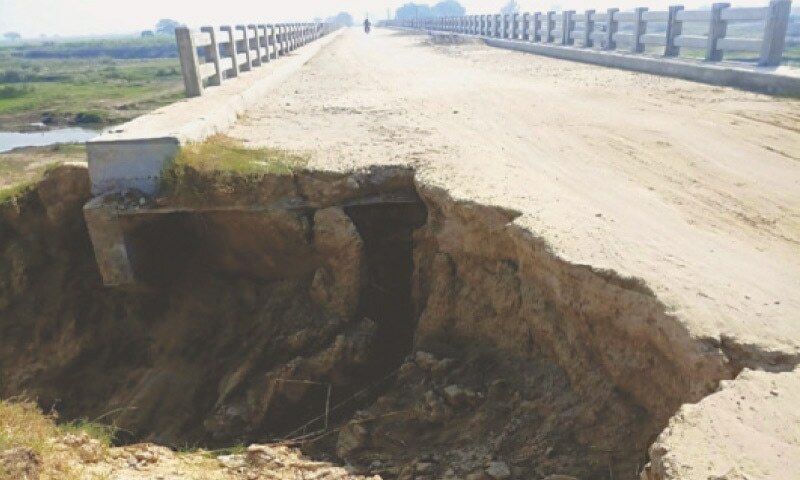 Incomplete bridge forces villagers to use boats for daily commute ...
