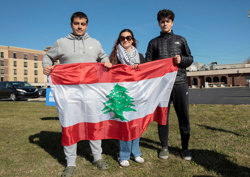 Lebanese American Noureddine and her nephews Ahmad and Eyad Hussein pose with a Lebanese flag during a “No Votes for Genocide” protest in Dearborn, Michigan, U.S. November 2. — Reuters