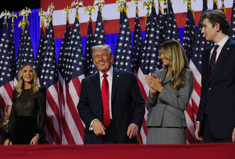 Republican presidential nominee and former US President Donald Trump smiles while accompanied by his wife Melania, Lara Trump and son Barron, at his rally, at the Palm Beach County Convention Center in West Palm Beach, Florida, US on November 6. &mdash; Reuters