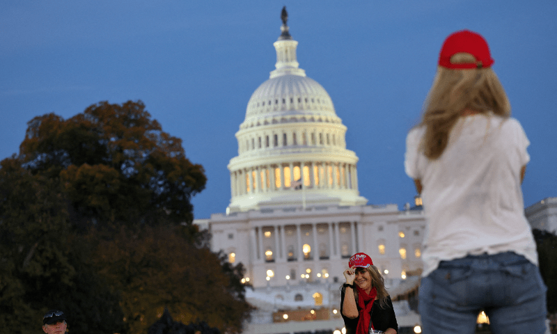  Trump supporters take photographs near the US Capitol building as the sun sets the day US President-Elect Donald Trump was declared the winner of the presidential election in Washington, on November 6. &mdash; Reuters 