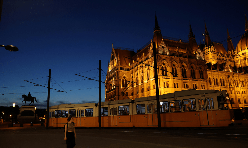  Tram passes by the Parliament building in downtown Budapest, Hungary, on September 11. &mdash; Reuters 