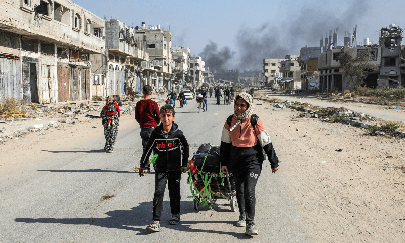  Displaced Palestinians make their way after fleeing the northern part of Gaza amid an Israeli military operation, in Gaza City on November 12. &mdash; Reuters 