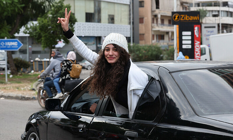 A Lebanese girl gestures as she arrives in the southern Lebanese city of Sidon on November 27 as displaced people make their way back to their homes in the south of Lebanon after a ceasefire between Israel and Hezbollah took effect. &mdash;AFP
