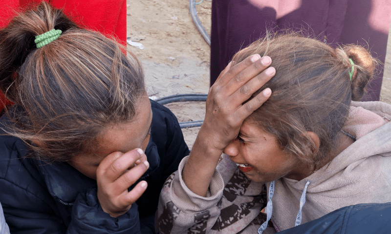  Children cry as people mourn Palestinians killed in an Israeli strike, at Nasser hospital in Khan Younis in the southern Gaza Strip, on Dec 5, 2024. &mdash; Reuters 